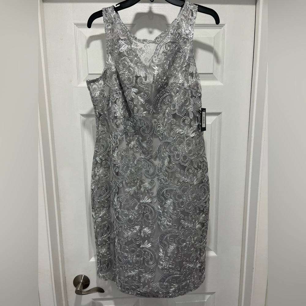 Silver dress brand new, size 14.